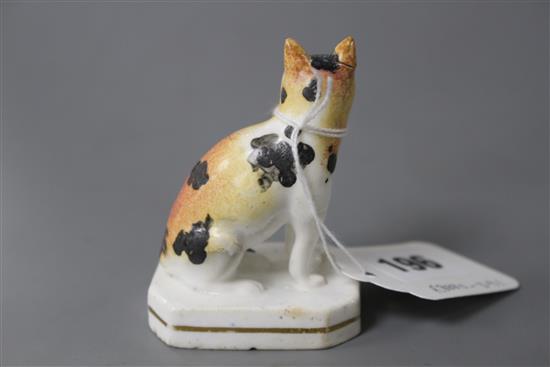 A rare Staffordshire porcelain figure of a seated cat, c.1835-50, H. 7.5cm